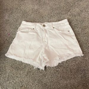 We are selling white shorts with ruffles on them